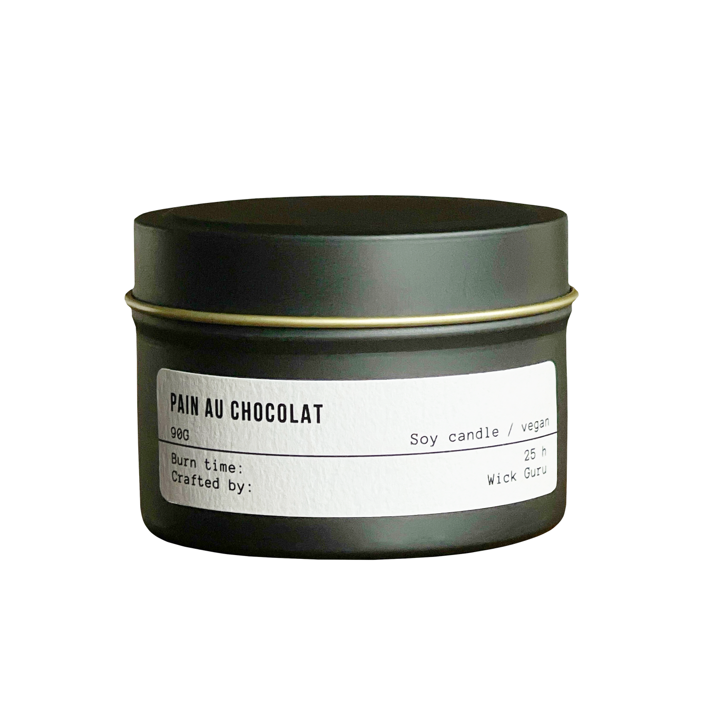 Candle in a green tin labeled 'Pain Au Chocolat' on a white background