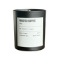 Black candle labeled 'Roasted Coffee' with a white label on a white background