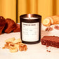 Banana Nut Bread scented candle with bread and nuts on a table