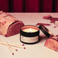 Candle with matches and a wooden log on a surface
