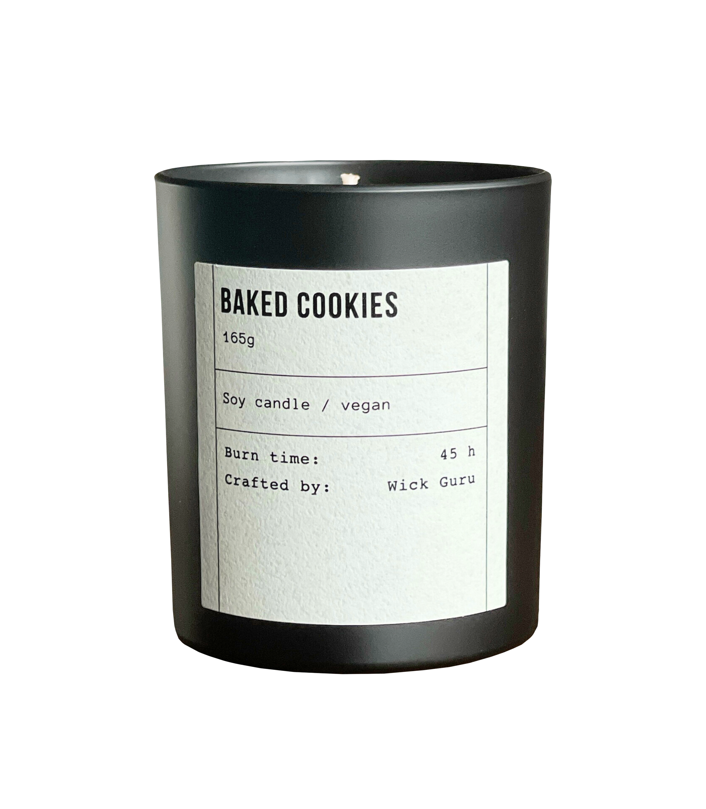 Black candle with a white label on a white background