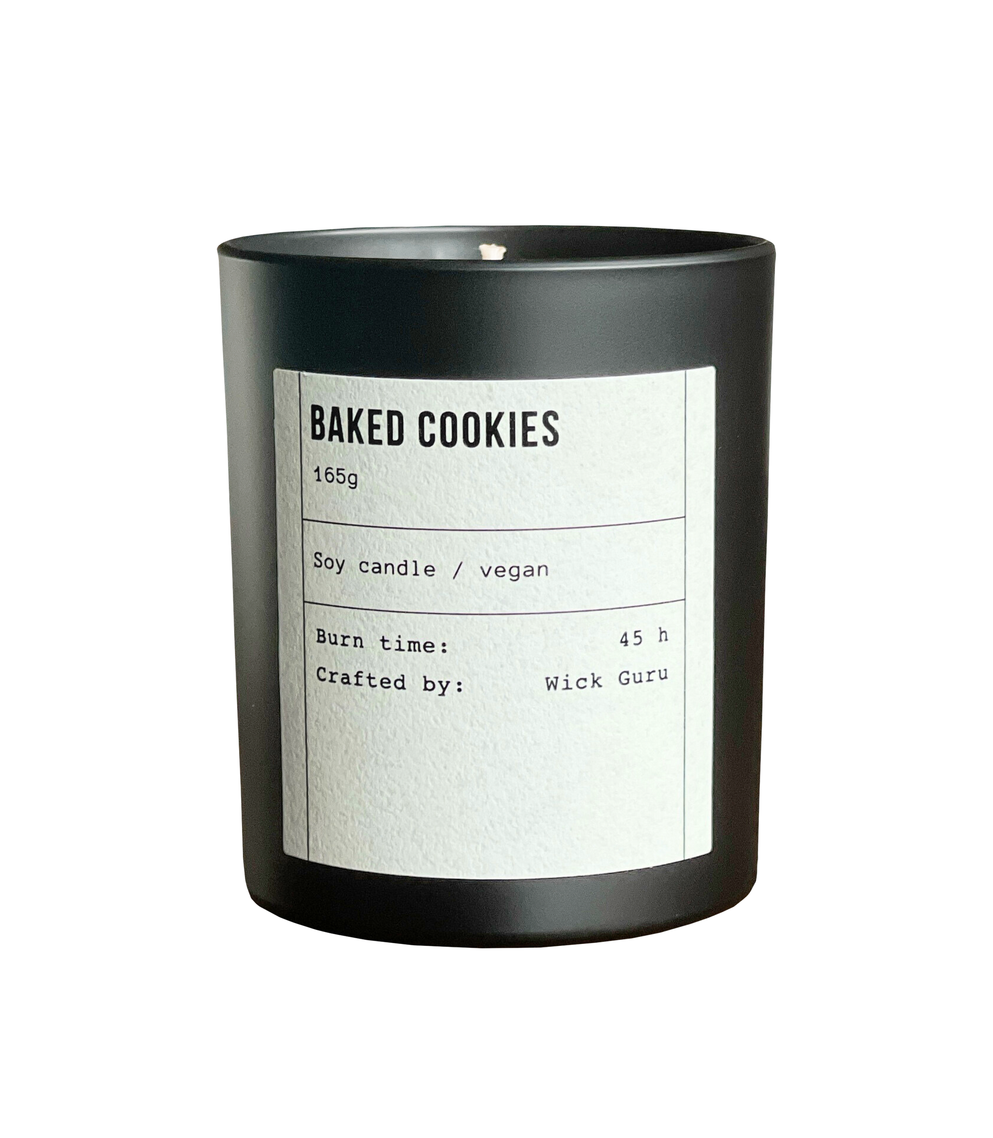 Black candle with a white label on a white background