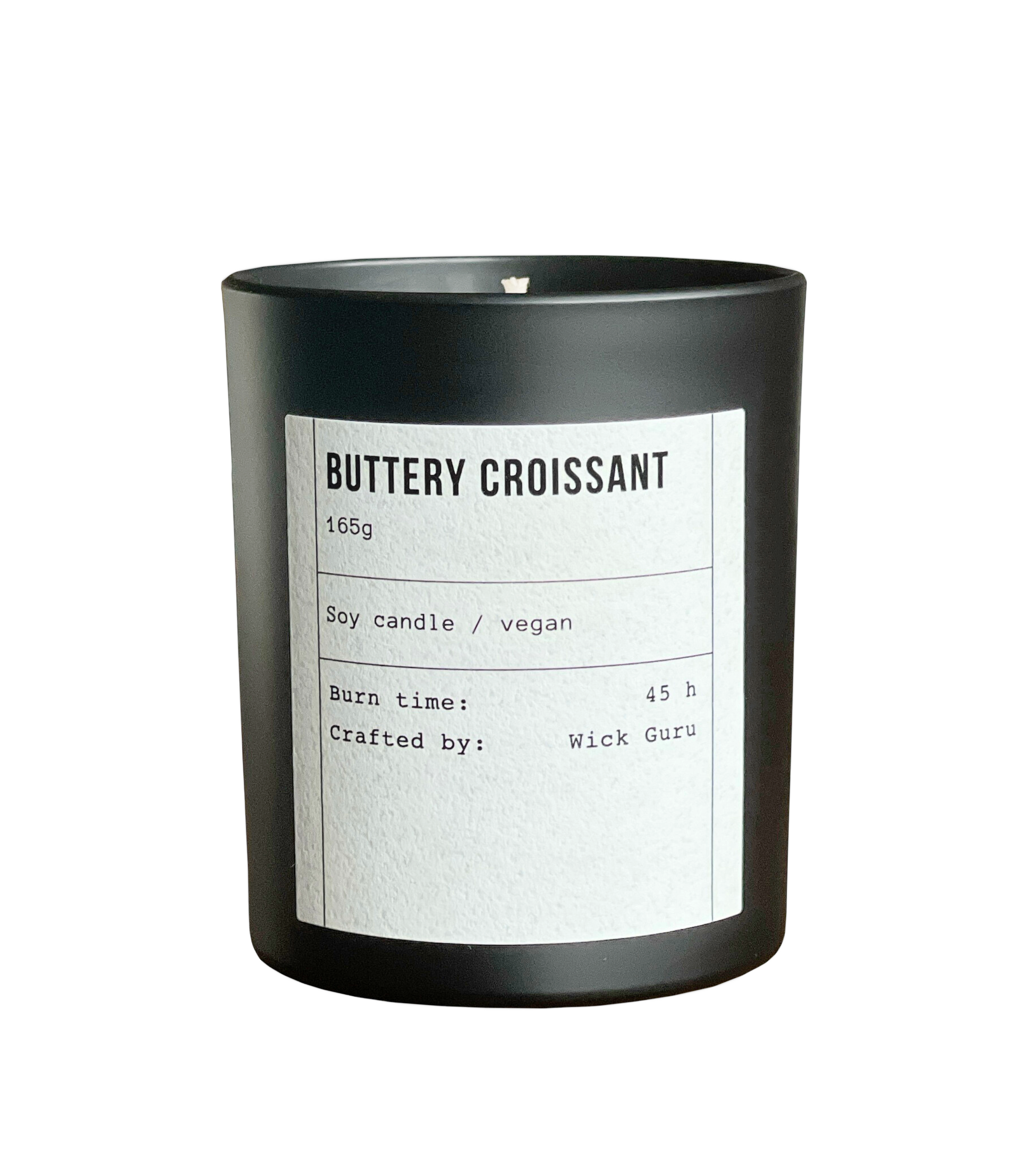 Black candle labeled 'Buttery Croissant' with details on a white background