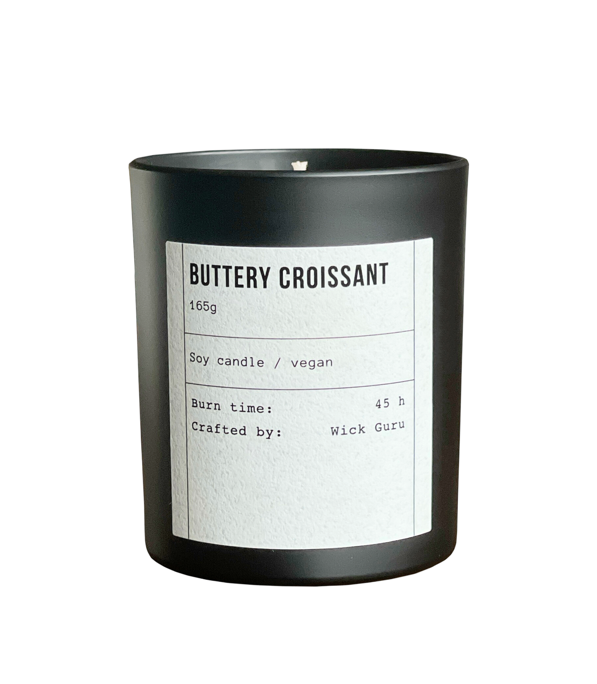 Black candle labeled 'Buttery Croissant' with details on a white background