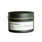 Candle in a green tin labeled 'Pain Au Chocolat' on a white background