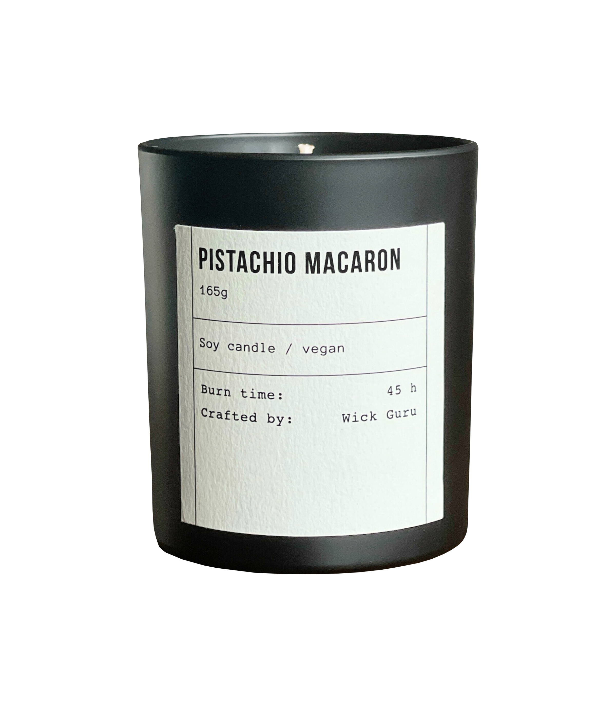 Candle labeled 'Pistachio Macaron' with black container and white label on a white background