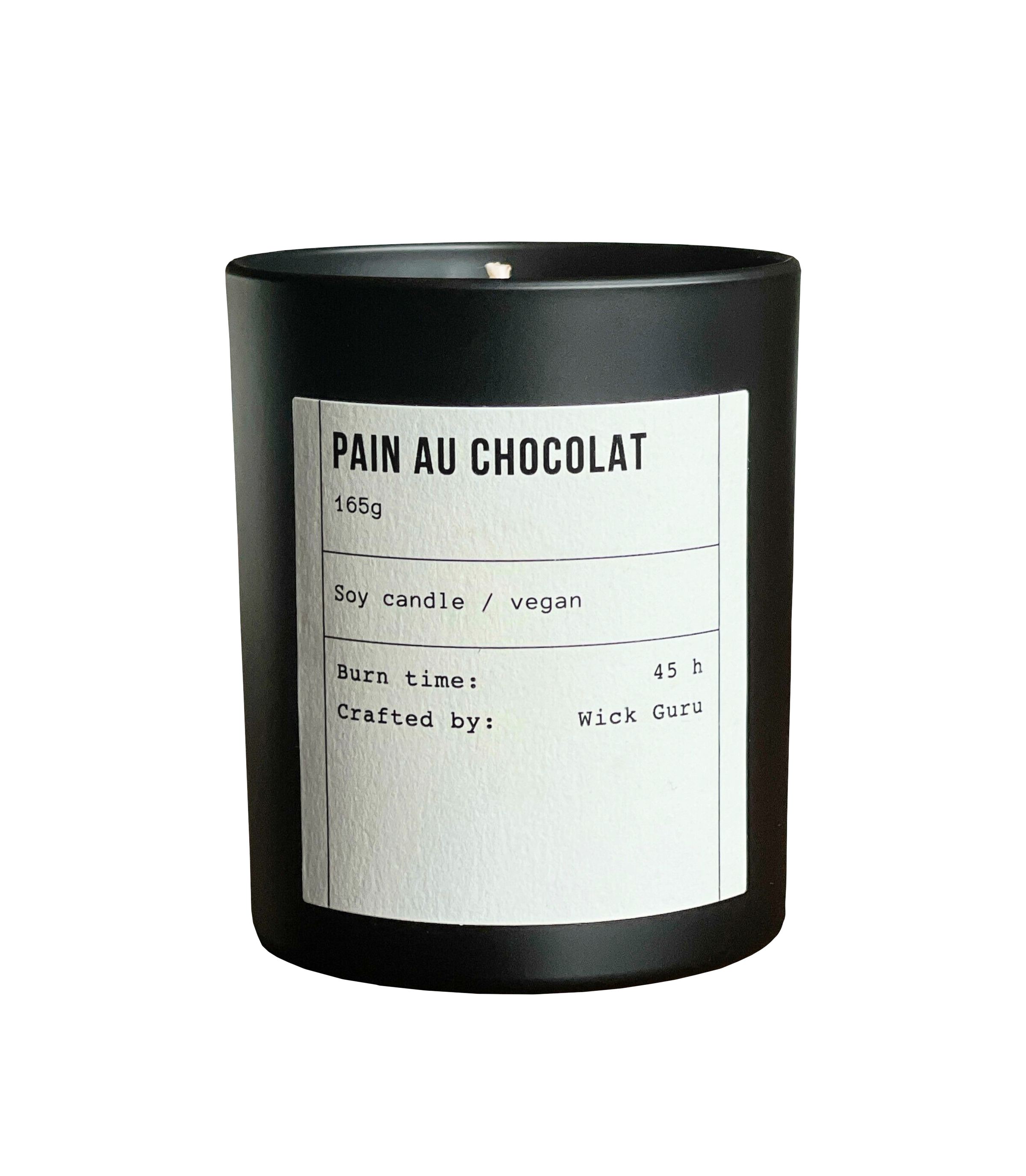 Candle labeled 'Pain Au Chocolat' with a black container on a white background