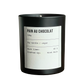 Candle labeled 'Pain Au Chocolat' with a black container on a white background