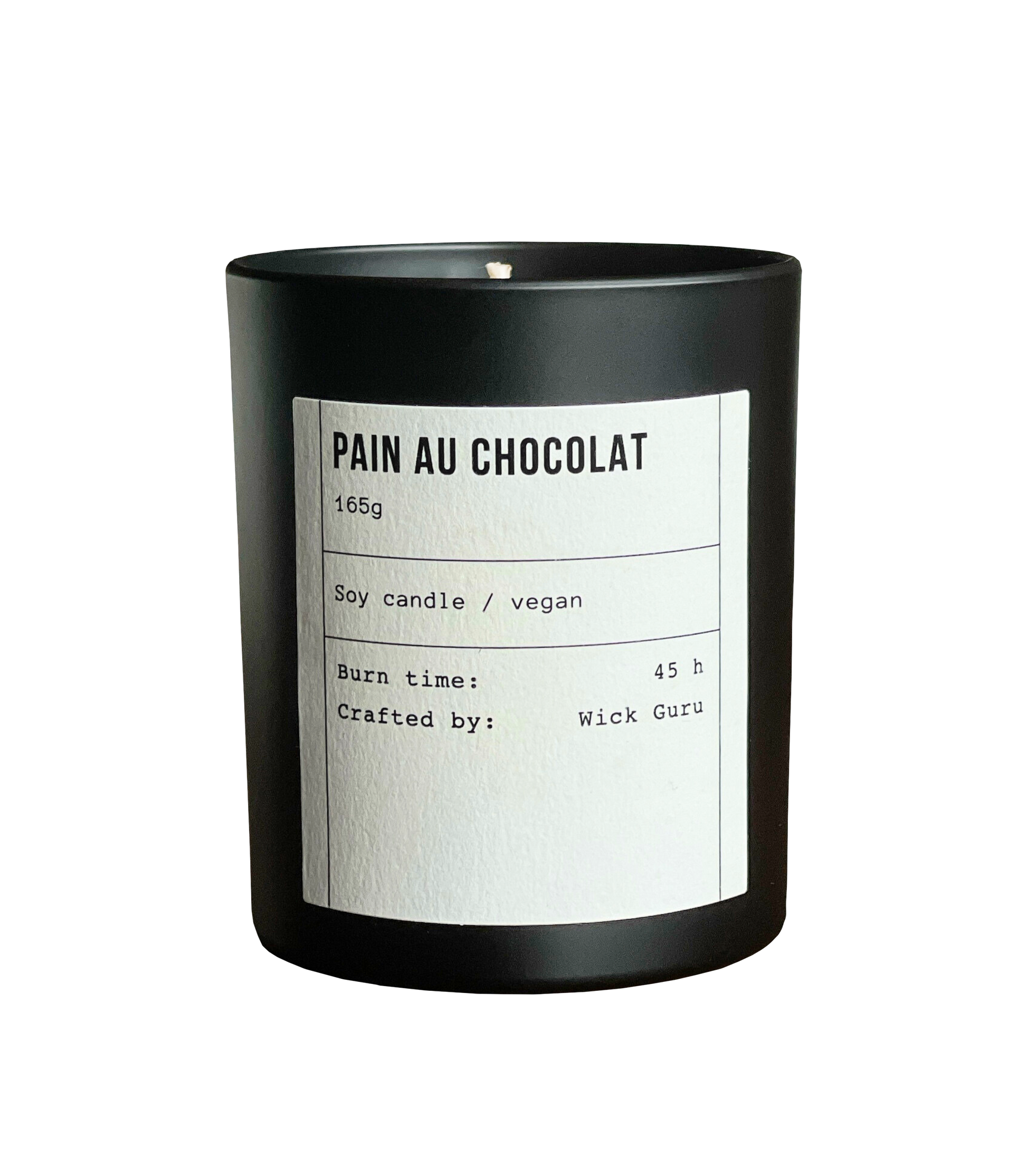 Candle labeled 'Pain Au Chocolat' with a black container on a white background