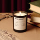Candle labeled 'Vintage Bookshop' on a table with books and glasses.