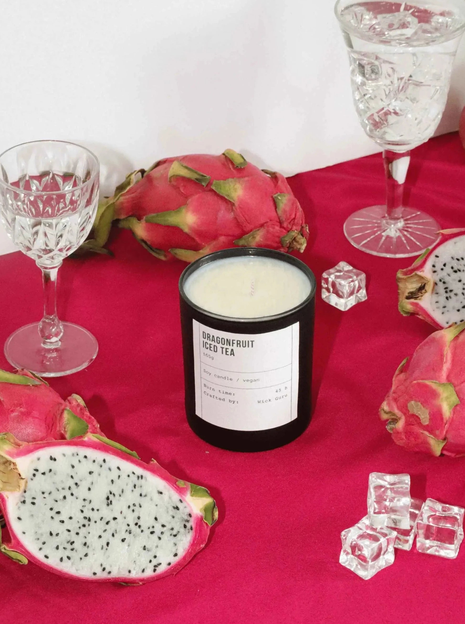 Dragonfruit Iced Tea Candle - A refreshing blend captured in a vibrant setting adorned with dragonfruits and peaches